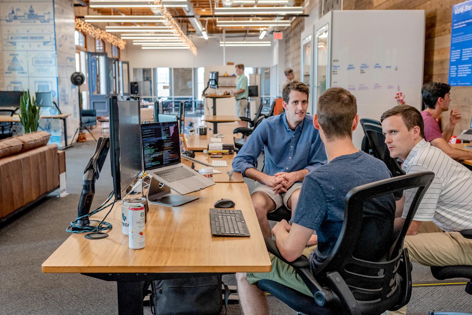 A remote support team working together around a shared table